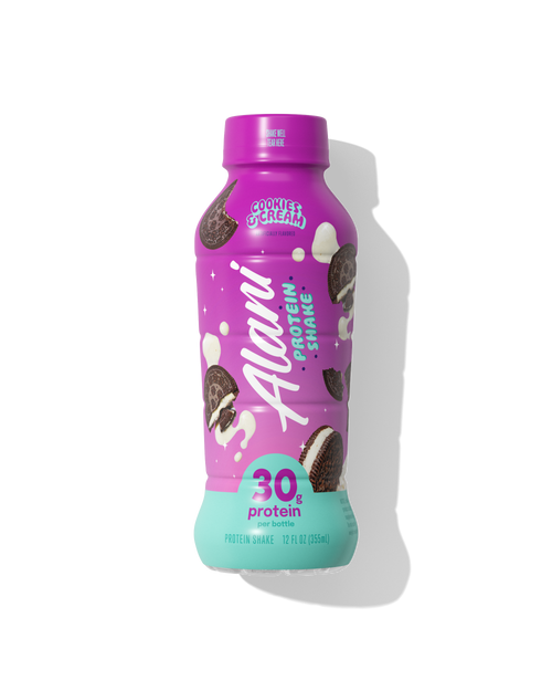 A singular ready-to-drink Cookies & Cream Alani Protein Shake with purple and seafoam packaging featuring classic chocolate sandwich cookies and cream splashes. 