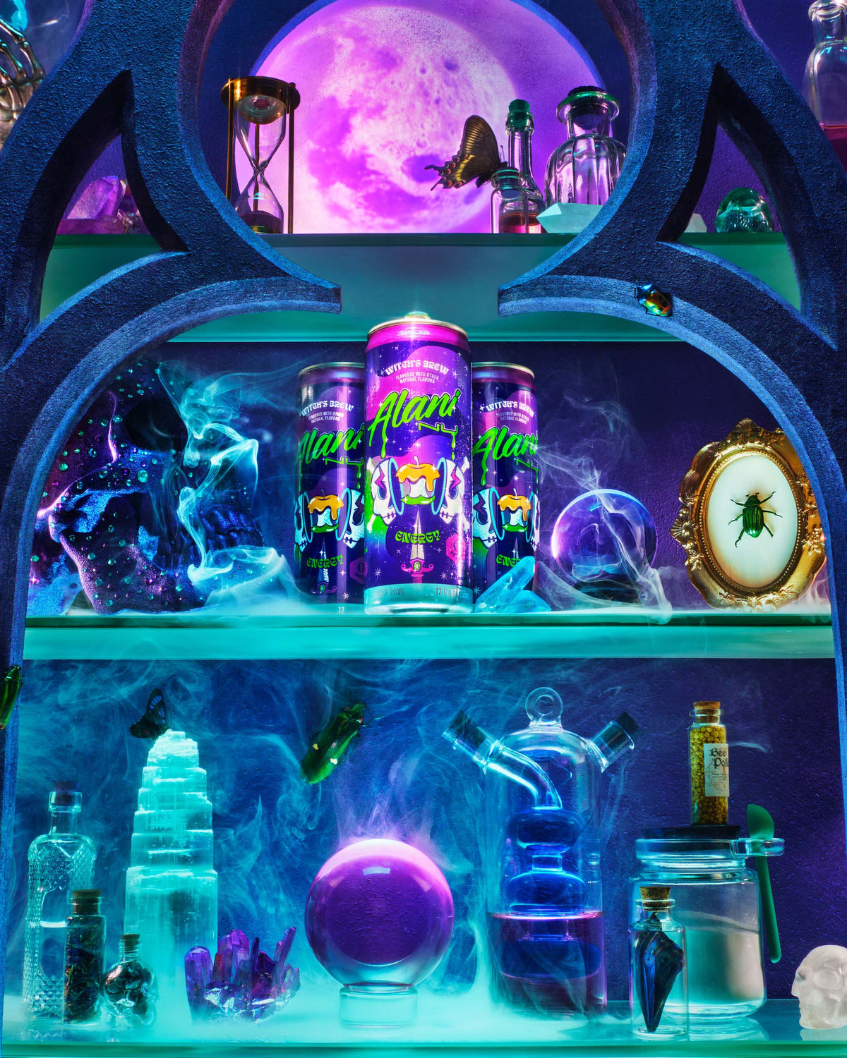 A collection of beakers, jars, crystals, and Witch&#39;s Brew Energy Drinks—all on a misty, moonlit apothecary shelf. 