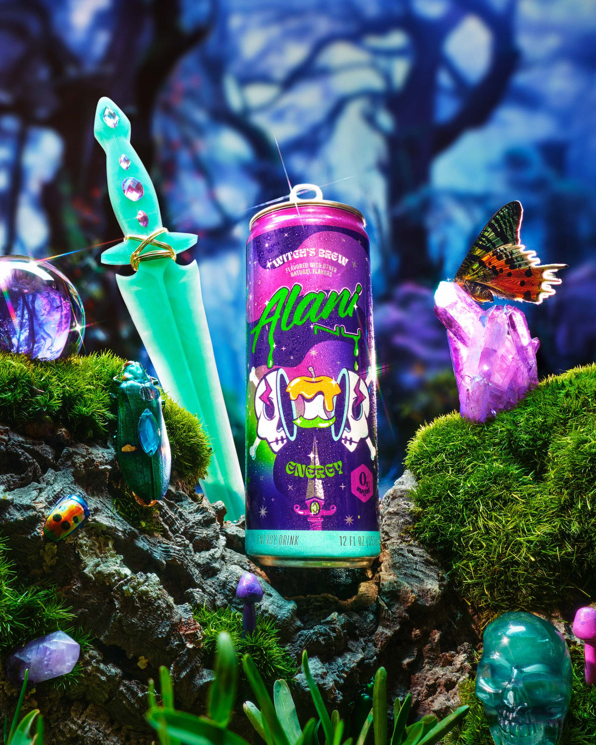 A crystal dagger and Witch&#39;s Brew seen on the floor of an enchanted forest alongside bejeweled beetles and butterflies. 