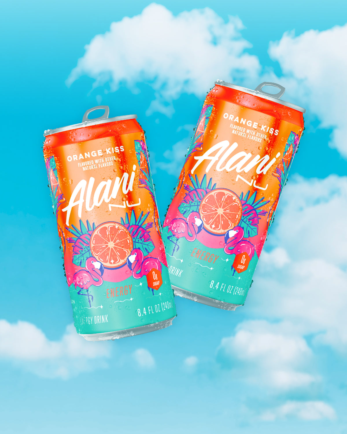 Two crisp Orange Kiss Mini Energy cans floating in front of a blue, cloudy sky. 