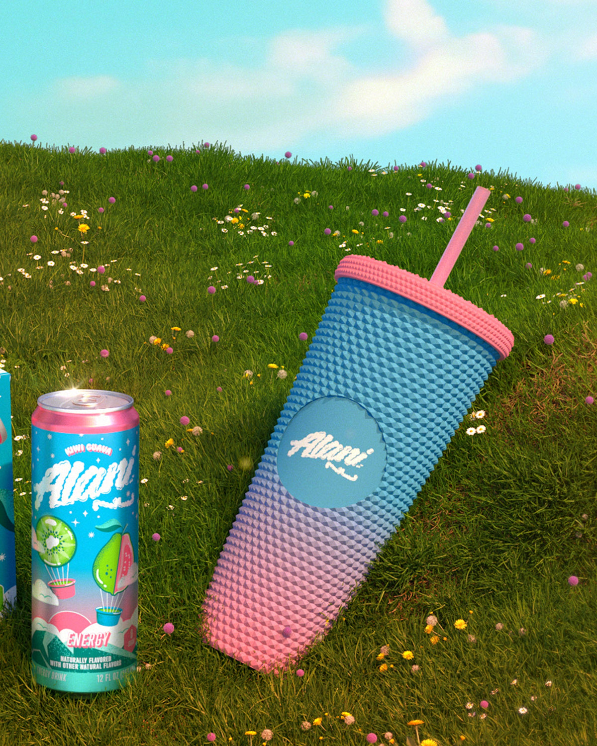 The Fly High Tumbler, BPA-free with a textured ombre design, is placed next to an &quot;Alani Nu&quot; can on grass under a clear sky.